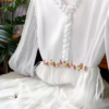 3209-1.png Ethereal White Ruffled Maxi Dress with Floral Embellishments