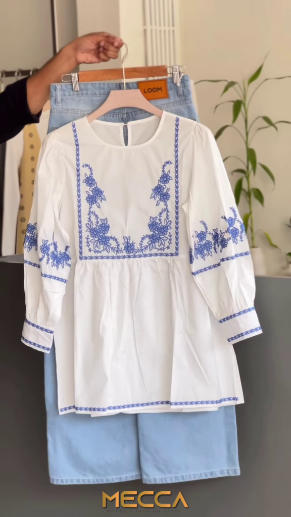 Embroidered White Peplum Tunic with Blue Floral Accents - Photo 1